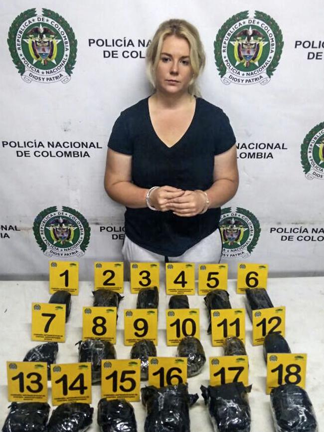 Cassie Sainsbury with the 5.8kg of cocaine she is accused of smuggling out of Columbia. Photo: Columbia Antinarcotics Police.