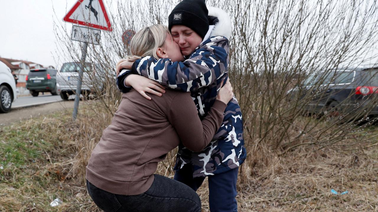 Anna Semyuk, 33, hugs her son at the Beregsurany border crossing in Hungary on February 26, 2022. Picture: Reuters/Bernadett Szabo