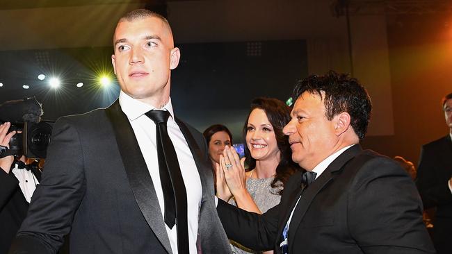 Martin gets a pat on the back by his manager Ralph Carr after winning the Brownlow Medal. Picture: Getty