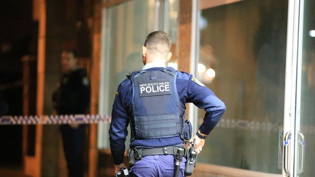 Police at the scene in Narraweena after a police officer was stabbed and man shot. Picture: Christian Gilles