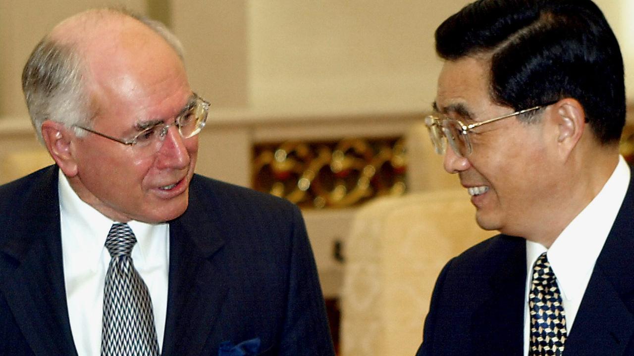 John Howard chats with former Chinese president Hu Jintao in Beijing, China in 2003. Picture: AFP