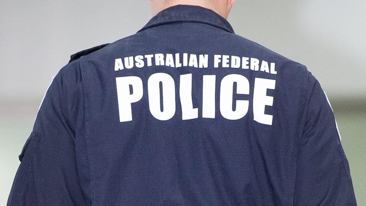 Two AFP officers have been sacked and another two have quit amid a corruption inquiry.