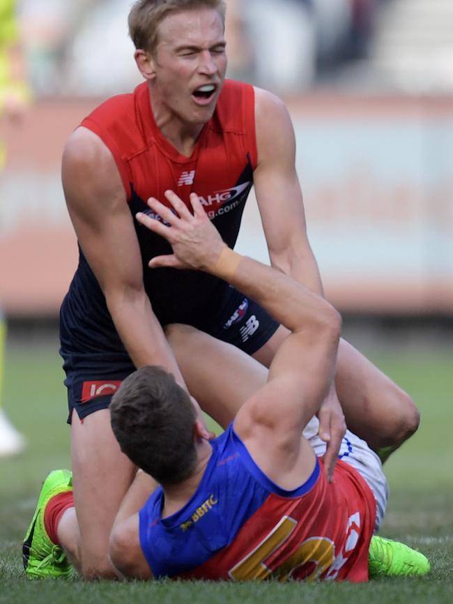 Vince gets pushed from Dayne Zorko. Picture: AAP