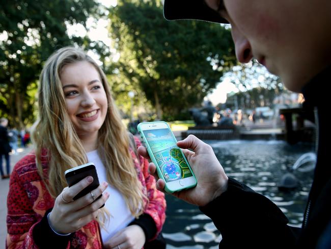 Pictured is Tamra Foy and Finn Melville playing Pokemon Go at Hyde Park which is one of many hotspots for the game around Sydney. Picture: Richard Dobson