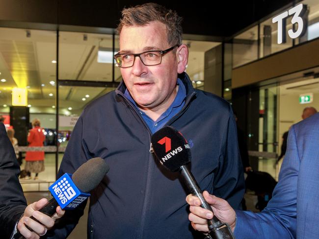 Daniel Andrews greeted by media at Melbourne airport after returning from China in March. Picture: David Geraghty