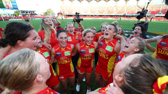 GOLD COAST, AUSTRALIA - FEBRUARY 15: Suns celebrate winning the round 2 AFLW match between the Gold Coast Suns and the Richmond Tigers at Metricon Stadium on February 15, 2020 in Gold Coast, Australia. (Photo by Chris Hyde/AFL Photos/Getty Images)