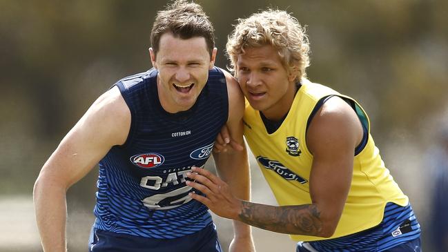 Patrick Dangerfield (left) and Quinton Narkle are both Midfielders in SuperCoach next year.