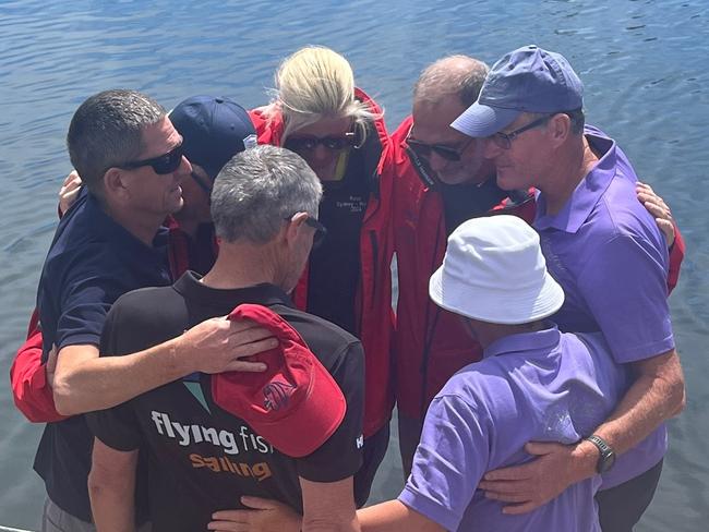 Friends of two sailors killed during the Sydney to Hobart gather for a tribute at Constitution dock in Hobart.