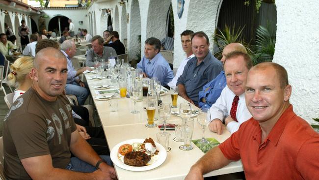 Allan Langer (R) with John Grainer (behind him) and retiring Broncos' player Andrew Gee (L) at the Hotel for the launch of a new steak in August, 2003. Picture: David Kapernick