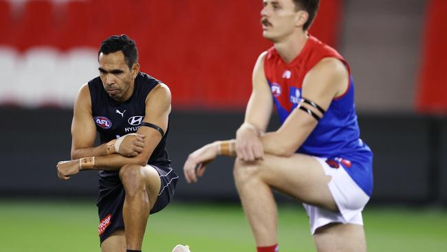 Eddie Betts, left, takes a knee before Carlton’s match against Melbourne on Saturday. Picture: Michael Klein