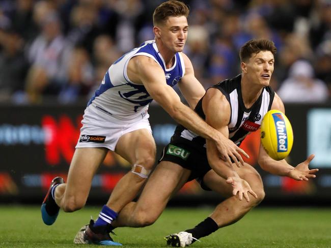 Kangaroos Shaun Atley (left) competes against Brody Mihocek of the Magpies. Picture: Michael Willson/AFL Photos via Getty Images