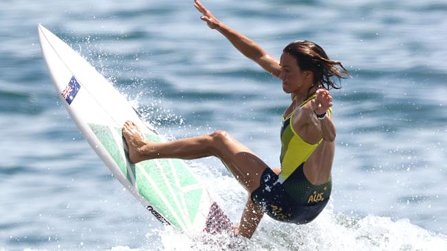 Sally Fitzgibbons get her final bit of practice in before the start of the surfing competition.