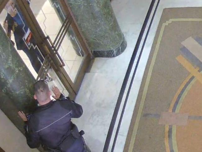 CCTV footage shows Senior Constable Paul Withers interact with Katrina Dawson at the Lindt Cafe in Martin Place. Constable Withers was the first responded on the morning of the siege.