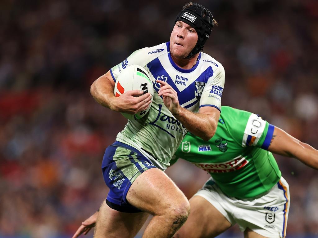 BRISBANE, AUSTRALIA – MAY 17: Matt Burton of the Bulldogs runs the ball during the round 11 NRL match between Canberra Raiders and Canterbury Bulldogs at Suncorp Stadium, on May 17, 2024, in Brisbane, Australia. (Photo by Hannah Peters/Getty Images)