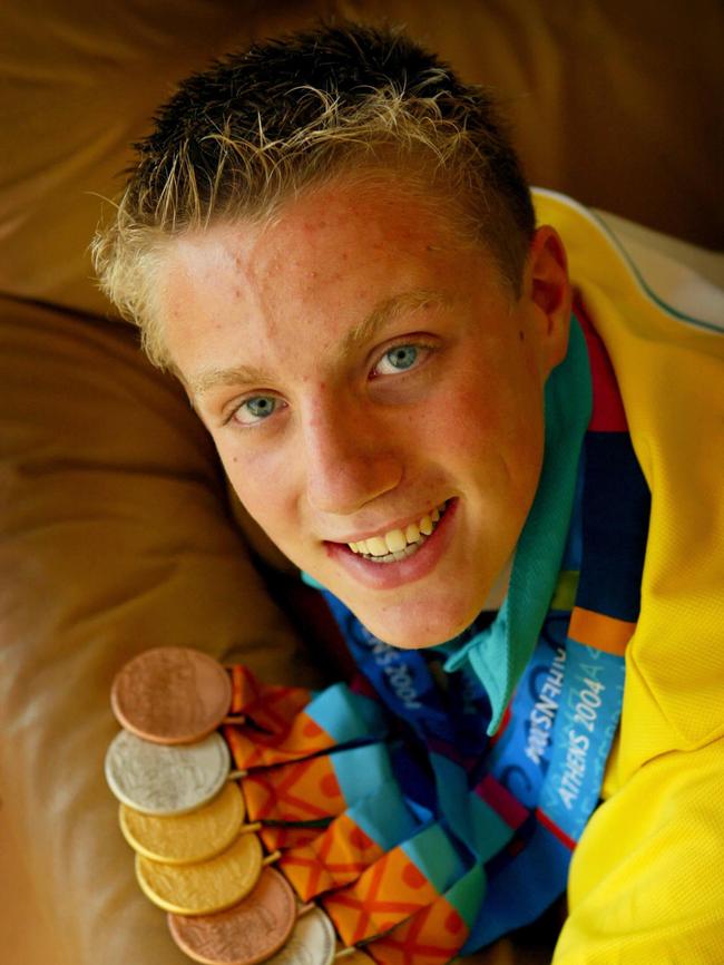 Paralympian Matt Cowdrey with his 7 medals he won at the Games in Athens.