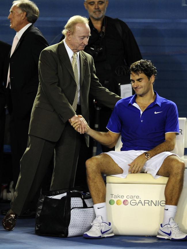 Roger Federer is consoled by Rod Laver after the 2010 Australian Open final.