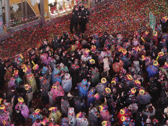 Confetti drops over the crowd as the clock strikes midnight during the New Year's celebration in Times Square as seen from the Marriott Marquis in New York. Picture: AP