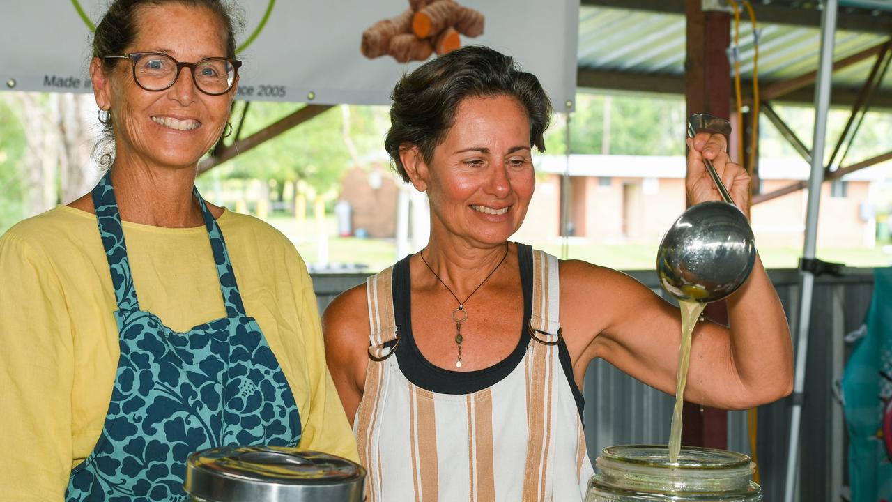 Nutritionist Portia Tresselt and Leisa Hawkey with their organic lime and turmeric juice at the Lismore Farmers Markets.