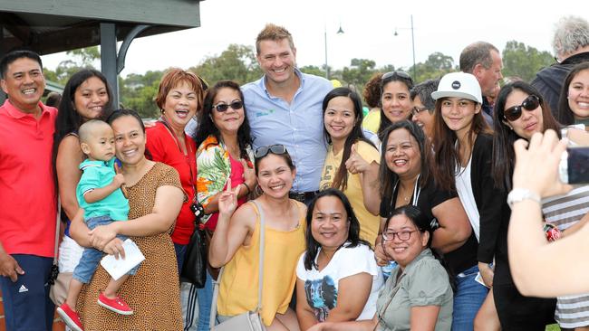 Darren Thomas with abattoir workers at a barbecue in Murray Bridge after the fire. Picture:<b/>Russell Millard/AAP