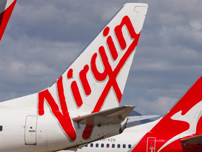 Townsville, Queensland - 28 July 2021: Virgin Australia and Qantas tails on display at Townsville Airport in far North Queensland27 October 2024Kendall HillPhoto - Getty Images