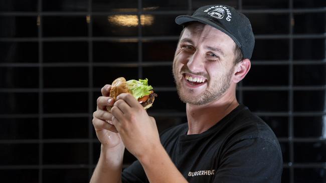 Josh Deluca with the Louis burger at his hugely successful restaurant Burger Head in Penrith. Picture: Monique Harmer