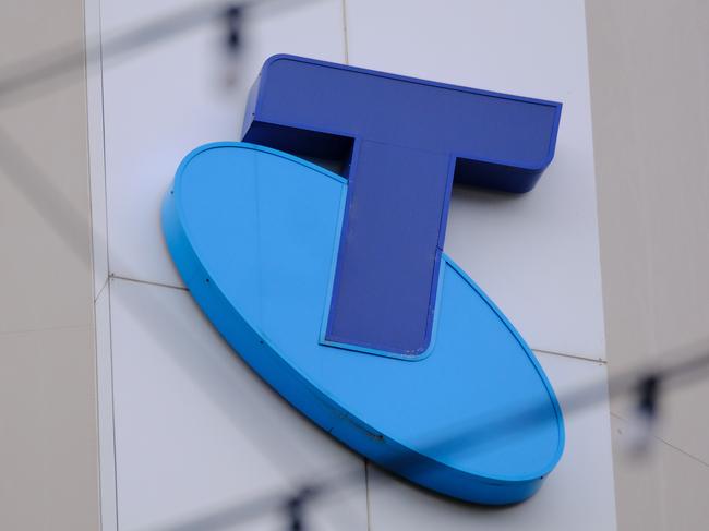 MELBOURNE, AUSTRALIA - NewsWire Photos OCTOBER 4, 2022. Generic photo people walking past the Telstra logo in Melbourne..Picture: NCA NewsWire / Luis Enrique Ascui