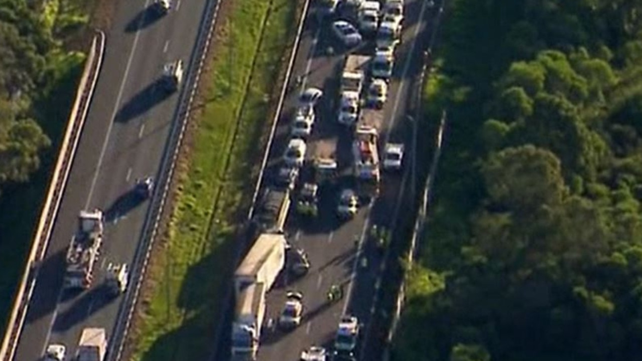 A man has died and several others have been injured in a pile-up on a busy highway in Queensland. Photo: 9 News