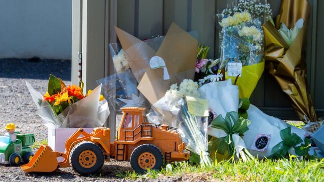 Flowers and toys left outside the house in Langwarrin. Picture: Jay Town