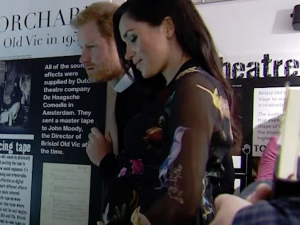 Meghan appears to glance down at her stomach and smile. Picture: YouTube