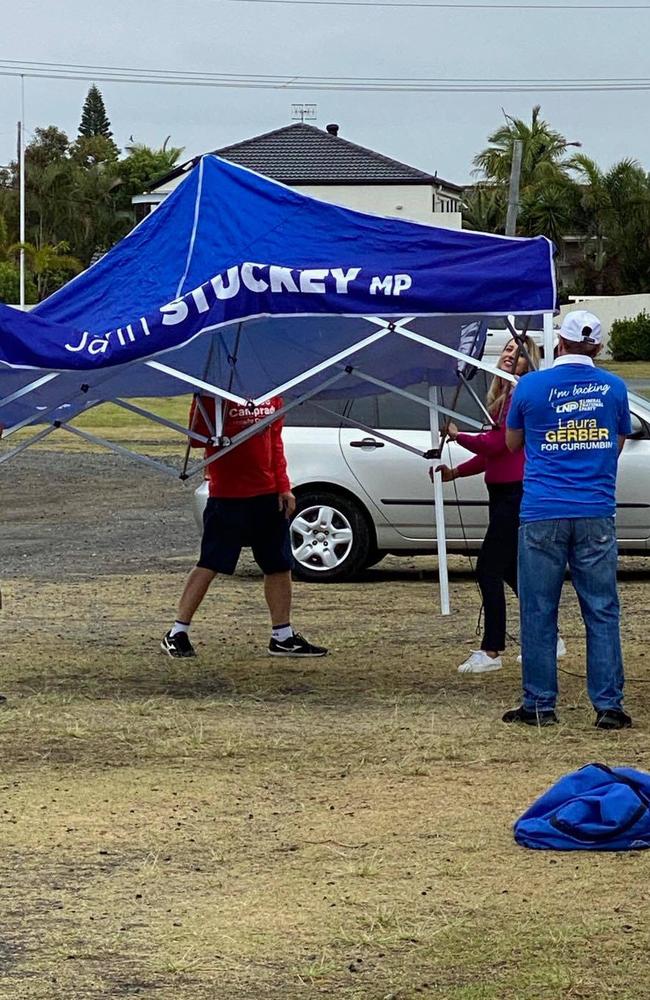 Currumbin MP Laura Gerber seen putting up a marquee at a prepoll station with former MP Jann Stuckey's name on it. Photo: Facebook