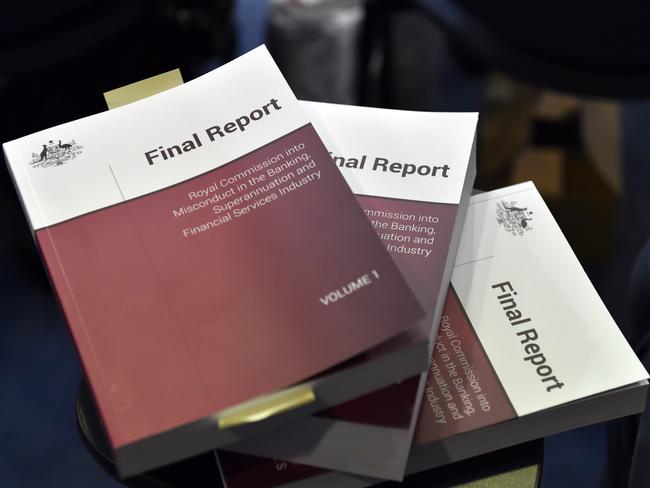 A copy of the report is seen at Treasurer Josh Frydenberg's press conference in response to the releasing of the Banking Royal Commission findings at Parliament House in Canberra, Monday, February 4, 2019. (AAP Image/Mick Tsikas) NO ARCHIVING