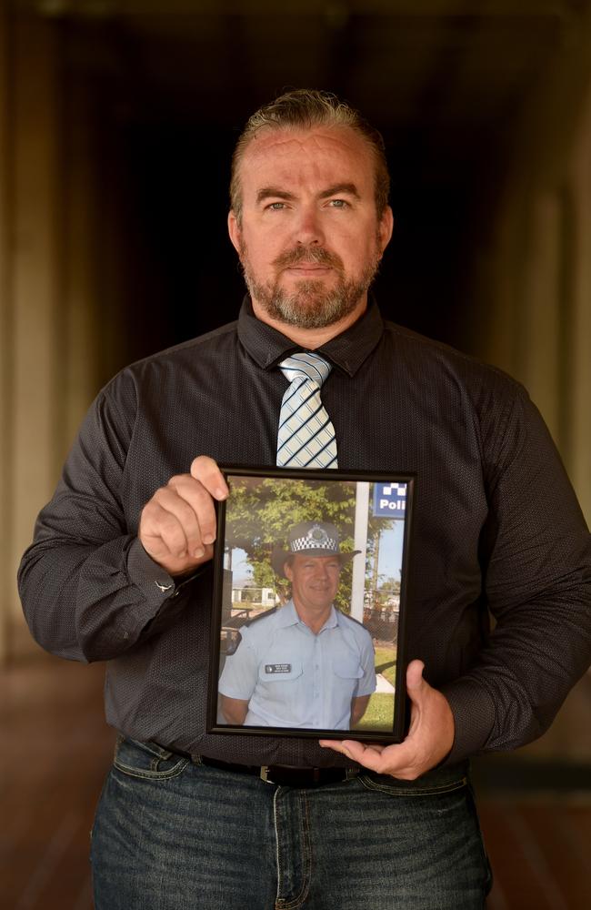 Steven Isles outside the Townsville Supreme Court with a photo of his missing father. Picture: Evan Morgan