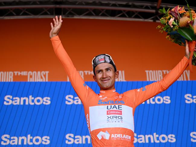 Jhonatan Narvaez celebrates at the podium as Orange Santos Leader's Jersey winner. Picture: Getty Images