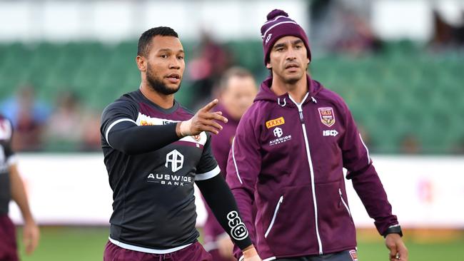 Mbye gets some advice from Johnathan Thurston. Image: AAP Image/Darren England