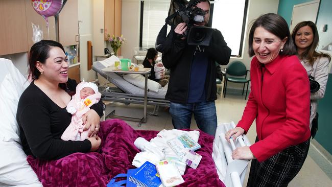 NSW Premier Gladys Berejiklian shares a laugh with new mother Ofa Katu with her baby Petilisa during a visit to Westmead Hospital on Sunday. Picture: AAP