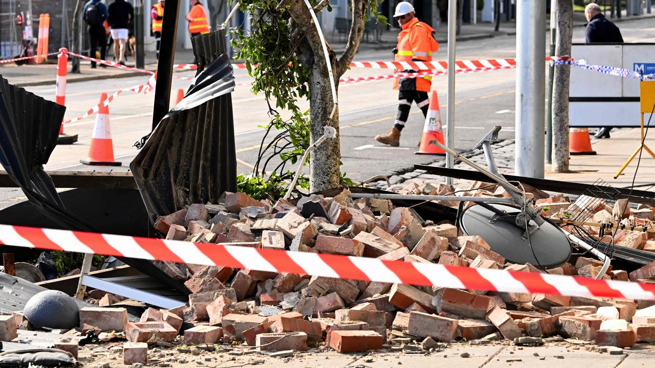 A collapsed facade of a building lies on the street in Melbourne on September 2 as winds of more than 110 km/h lashed the region, leaving about 150,000 people without power. Picture: William West/AFP