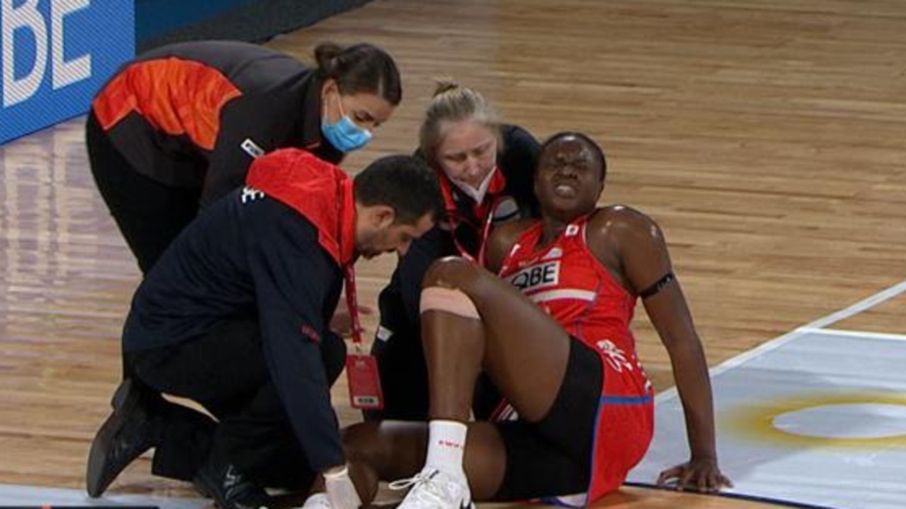 Sam Wallace goes down injured during the Super Netball derby.
