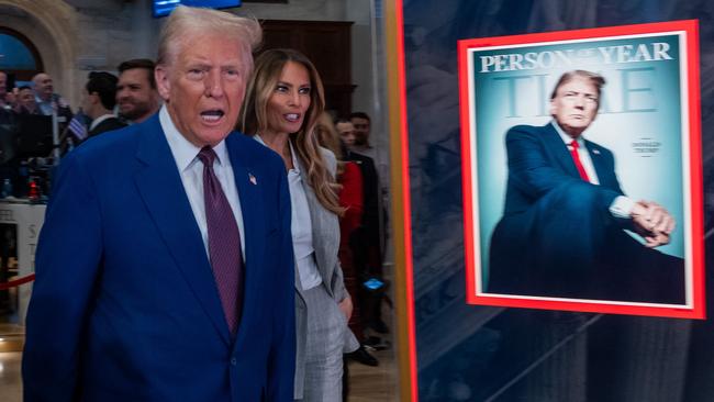 NEW YORK, NEW YORK - DECEMBER 12: President-elect Donald Trump walks onto the floor of the New York Stock Exchange (NYSE) with his wife Melania, after being named TIMEâs âPerson of the Yearâ for the second time on December 12, 2024 in New York City. Trump attended a reception and rang the opening bell on the trading floor.   Spencer Platt/Getty Images/AFP (Photo by SPENCER PLATT / GETTY IMAGES NORTH AMERICA / Getty Images via AFP)