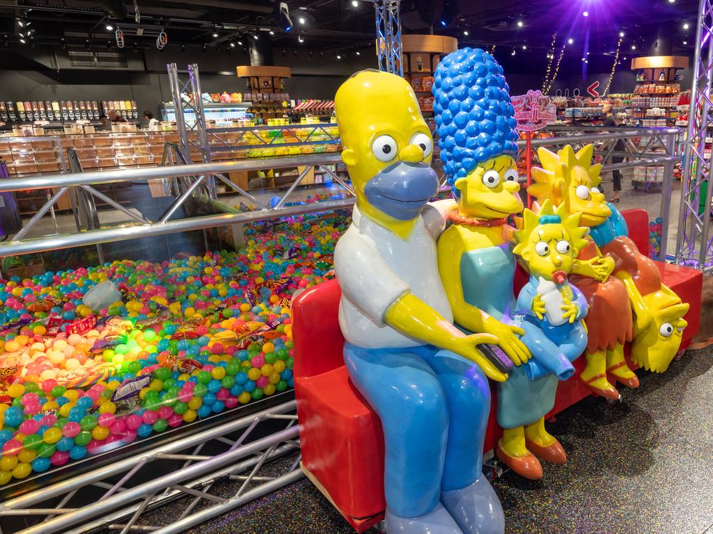 There are plastic Simpsons characters and a human claw machine. Picture: Supplied