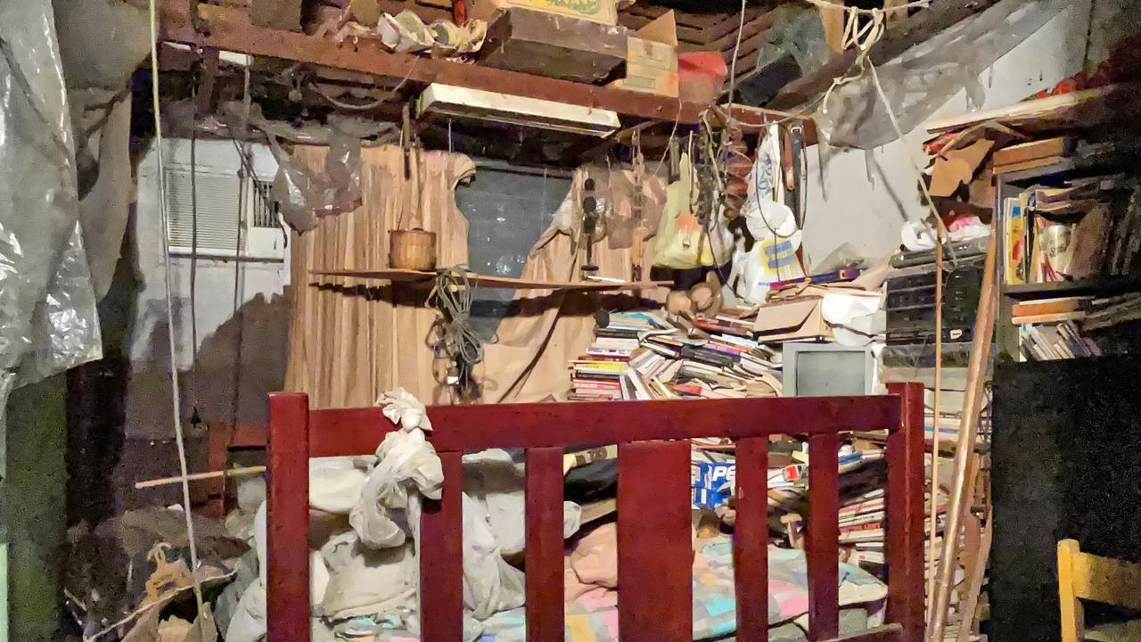 A bed surrounded by more books ... and other items