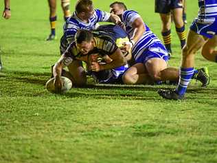 Reece Maughan crashes through the Brothers to score a try for the Waves Tigers. Picture: Brian Cassidy