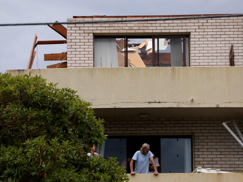 An apartment block with no roof on Pacific Parade at Dee Why Beach after a short wild windy storm ripped through the Northern Beaches. Picture: Damian Shaw