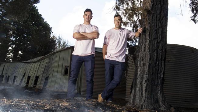 Will Young and Tom Latchford co-owners of SA Marquee, Wedding and Events at the remains of the shed where all of their equipment was stored. Picture: Brett Hartwig