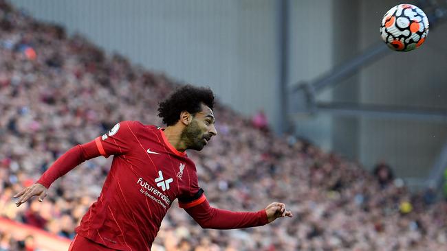 Liverpool midfielder Mohamed Salah heads the ball during an English Premier League match between Liverpool and Manchester City at Anfield. Picture: AFP.