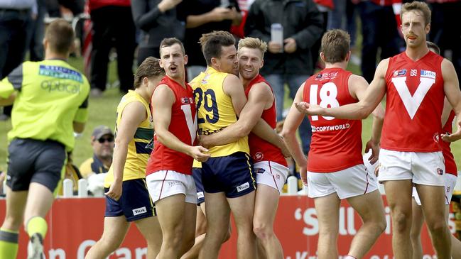 LET’S DANCE: North's Alex Spina and Mitchell Clisby share a tender moment with Eagles star Matthew Goldsworthy. Picture: Dean Martin/AAP