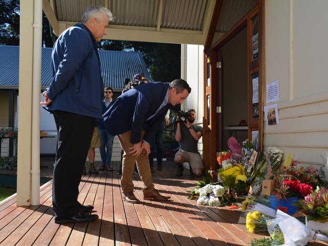 West Australian Premier Mark McGowan at the Margaret River Community Centre, where locals have laid flowers in tribute. Picture: AAP/Rebecca Le May