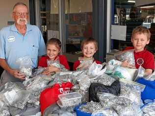 RICH PICKINGS: Wayne Hayes of Ringpull with Rachel, Declan and James from Parkhurst State School. Picture: Jann Houley