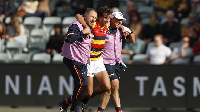 LAUNCESTON, AUSTRALIA – APRIL 25: Will Hamill of the Crows leaves the field injured during the 2021 AFL Round 06 match between the Hawthorn Hawks and the Adelaide Crows at UTAS Stadium on April 25, 2021 in Launceston, Australia. (Photo by Dylan Burns/AFL Photos via Getty Images)