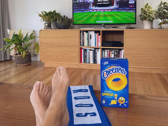 Dr Sonja Hood watching the North Melbourne game from home.