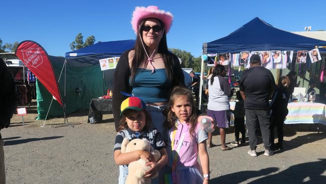 Krystal Kenny, Akeela Kenny and Atarah Kenny pose with their hats and prizes collected from the show. Photo: Laura Hooper.